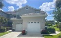 Rarely available this end unit showcases spectacular panoramic for sale in Naples Florida Collier County County on GolfHomes.com