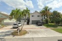 Stunning 5-Bed, 4.5-Bath courtyard pool home featuring vaulted for sale in Plantation Florida Broward County County on GolfHomes.com