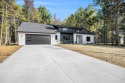 Discover your dream home with effortless living and modern for sale in Norton Shores Michigan Muskegon County County on GolfHomes.com