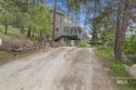 Beautifully situated in Terrace Lakes, this spacious tri-level for sale in Garden Valley Idaho Boise County County on GolfHomes.com