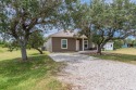 Welcome to 128 Pompano Dr - Your Slice of Paradise on the Texas for sale in Rockport Texas Aransas County County on GolfHomes.com