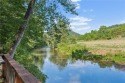 Escape city living in this stunning 2 bed/2 bath cabin plus loft for sale in Ellijay Georgia Gilmer County County on GolfHomes.com