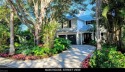 Just seven doors to Old Naples beaches, this distinctive and for sale in Naples Florida Collier County County on GolfHomes.com