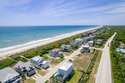 This exceptional oceanfront home in Roosevelt Beach showcases for sale in Pine Knoll Shores North Carolina Carteret County County on GolfHomes.com