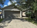 Welcome to this charming three-bed, two-bathroom home, nestled for sale in Kissimmee Florida Osceola County County on GolfHomes.com