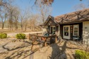 Enjoy stunning golf-front views of the #5 Fairway from the front for sale in Bella Vista Arkansas Benton County County on GolfHomes.com