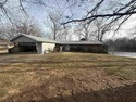 This charming 3-bedroom, 2.5-bath home sits on Lake Omaha in for sale in Cherokee Village Arkansas Fulton County County on GolfHomes.com