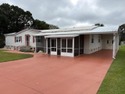 Come and take a look at this large triple-wide manufactured home for sale in Mount Dora Florida Lake County County on GolfHomes.com