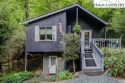 This is a very cozy, year round, one level living mountain for sale in Newland North Carolina Avery County County on GolfHomes.com