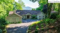 The home sits in a secluded setting with circular drive and for sale in Banner Elk North Carolina Watauga County County on GolfHomes.com