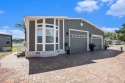 Introducing a captivating mobile home nestled in the serene for sale in Odessa Florida Hillsborough County County on GolfHomes.com