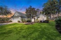 Enjoy serene views of the 8th green of the Okatie Creek golf for sale in Bluffton South Carolina Beaufort County County on GolfHomes.com