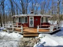 COZY FAWN LAKE HOME!  Unique Round Style home set on a level for sale in Hawley Pennsylvania Pike County County on GolfHomes.com