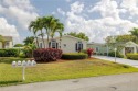Enjoy peaceful water views and your own Mango Tree from this for sale in Port Saint Lucie Florida Saint Lucie County County on GolfHomes.com