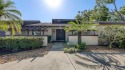 Tucked away among mature trees and lush landscaping, this for sale in Bradenton Florida Manatee County County on GolfHomes.com