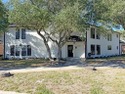 This classic-style 2-story residence is a statement of elegance for sale in Rockport Texas Aransas County County on GolfHomes.com