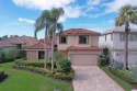 Stunning enlarged updated patio with screened in enclosure for sale in Palm Beach Gardens Florida Palm Beach County County on GolfHomes.com