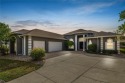 Tucked away on a quiet cul-de-sac in the Grasslands Golf and for sale in Lakeland Florida Polk County County on GolfHomes.com