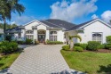 AMAZING show stopper 3B/3.5ba/2car gar., DEN & golf cart bay for sale in Palm City Florida Martin County County on GolfHomes.com