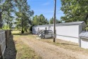 Nestled in a serene lakeside setting, this charming 3-bedroom for sale in Union City Michigan Calhoun County County on GolfHomes.com