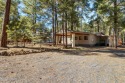 Escape to mountain bliss in this 3-bedroom, 2-bathroom retreat for sale in Pinetop Arizona Navajo County County on GolfHomes.com