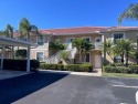 GOLF INCLUDED with this bright end unit condo in Cypress Woods for sale in Naples Florida Collier County County on GolfHomes.com