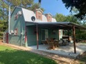 Outstanding view of a 80 plus acre private lake . Charming 3 bed for sale in Clarksville Texas Red River County County on GolfHomes.com