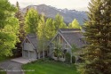 Bordering the 11th fairway of the prestigious Teton Pines golf for sale in Wilson Wyoming Teton County County on GolfHomes.com