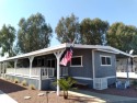 Step up onto your spacious, fully-fenced, extra-wide front deck for sale in Needles California San Bernardino County County on GolfHomes.com