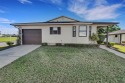 Located in the sought-after 55+ gated Highland Fairways Golf for sale in Lakeland Florida Polk County County on GolfHomes.com