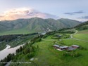 Perched above the Snake River with commanding views of Wolf for sale in Jackson Wyoming Teton County County on GolfHomes.com