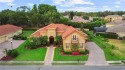 Lovely Meditterrean home welcomes you through rustic double for sale in Lakeland Florida Polk County County on GolfHomes.com