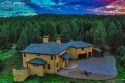This meticulously designed luxury estate sits on 40 acres of for sale in Woodland Park Colorado Teller County County on GolfHomes.com