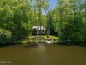 Welcome to your serene lakeside retreat in the highly desirable for sale in Greentown Pennsylvania Pike County County on GolfHomes.com