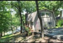 Lakefront home in popular Port Duncan with boat dock.  This home for sale in Afton Oklahoma Delaware County County on GolfHomes.com