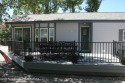 Immaculately maintained Park Model on nice corner lot with green for sale in Thayne Wyoming Lincoln County County on GolfHomes.com