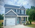 Schedule your tour of this beautiful new home with screened for sale in Clayton North Carolina Johnston County County on GolfHomes.com