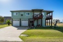 MOVE IN READY!!! Charming Island Style 3/2.5 home on 2 lots for sale in Rockport Texas Aransas County County on GolfHomes.com