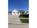 Enjoy golf course and water views from the deck of this well for sale in Council Bluffs Iowa Pottawattamie County County on GolfHomes.com