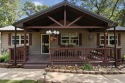 Nestled in tall trees on a 1 acre lot this home features a cozy for sale in Kansas Oklahoma Delaware County County on GolfHomes.com