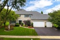 Welcome to this exquisite home nestled down a tree-lined street for sale in Naperville Illinois Will County County on GolfHomes.com