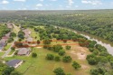 Private paradise nestled along the river with water views for sale in Granbury Texas Hood County County on GolfHomes.com