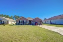 Welcome to this 4 BR, 2 bath, attached 2 car garage home for sale in Ocala Florida Marion County County on GolfHomes.com