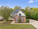 Nestled in a peaceful setting in Gates Four, this beautiful home for sale in Fayetteville North Carolina Cumberland County County on GolfHomes.com