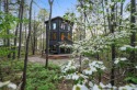 The Howling Wolf* is a towering getaway cabin with an amazing for sale in Broken Bow Oklahoma McCurtain County County on GolfHomes.com