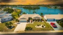 Nestled on the tranquil edge of Middle Lake, this home is for sale in Sun City Center Florida Hillsborough County County on GolfHomes.com