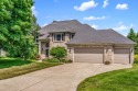 Enjoy serene cul-de-sac living in the highly sought-after for sale in Portage Michigan Kalamazoo County County on GolfHomes.com