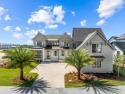 Prominently positioned behind the private gates of Camp Creek for sale in Inlet Beach Florida Walton County County on GolfHomes.com