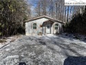 This charming two-bedroom, one-and-a-half-bath cottage features for sale in Newland North Carolina Avery County County on GolfHomes.com