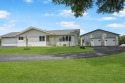 Situated on nearly an acre along a hard-surfaced road at the for sale in Aplington Iowa Butler County County on GolfHomes.com